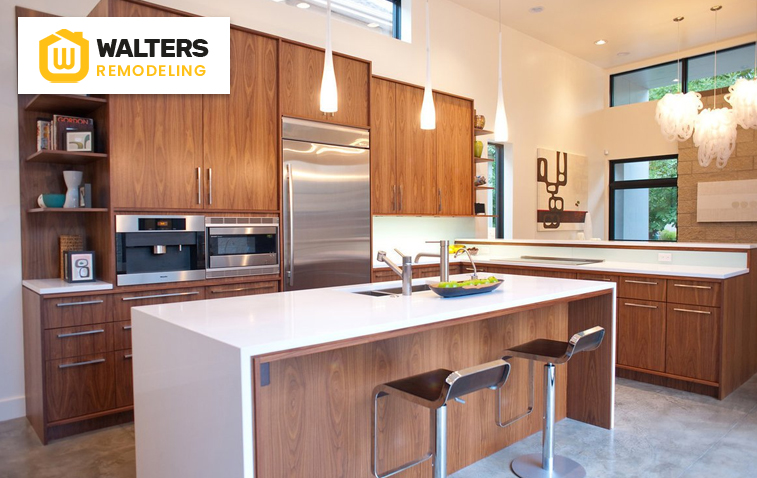 Well-lit kitchen with designated work surfaces and modern appliances.